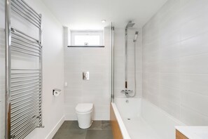 Bathtub, hair dryer, towels