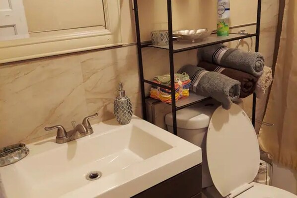 Shower, hair dryer, towels, soap