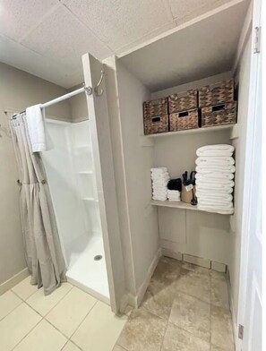 Shower, hair dryer, towels, soap