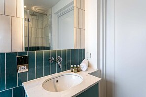 Bathtub, hair dryer, towels