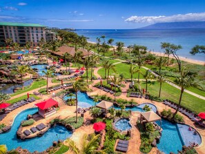 A resort with multiple swimming pools, lounge areas, and a view of the ocean. - HONUA KAI RESORT-Hokulani 314 - 106 ⭐️⭐️⭐️⭐️⭐️ FIVE STAR REVIEWS - OCEAN & MNT VIEWS (Lahaina)