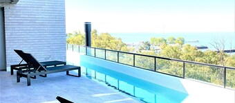 Stylish apartment by river with pool & grill