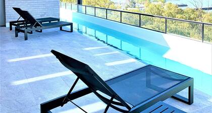 Stylish apartment by river with pool & grill