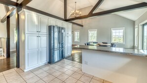 A spacious kitchen with white cabinetry, a large island, and a modern chandelier. - 5BR Farmhouse☆King Size Bed☆Mountain View☆28 Acres (Ancramdale)