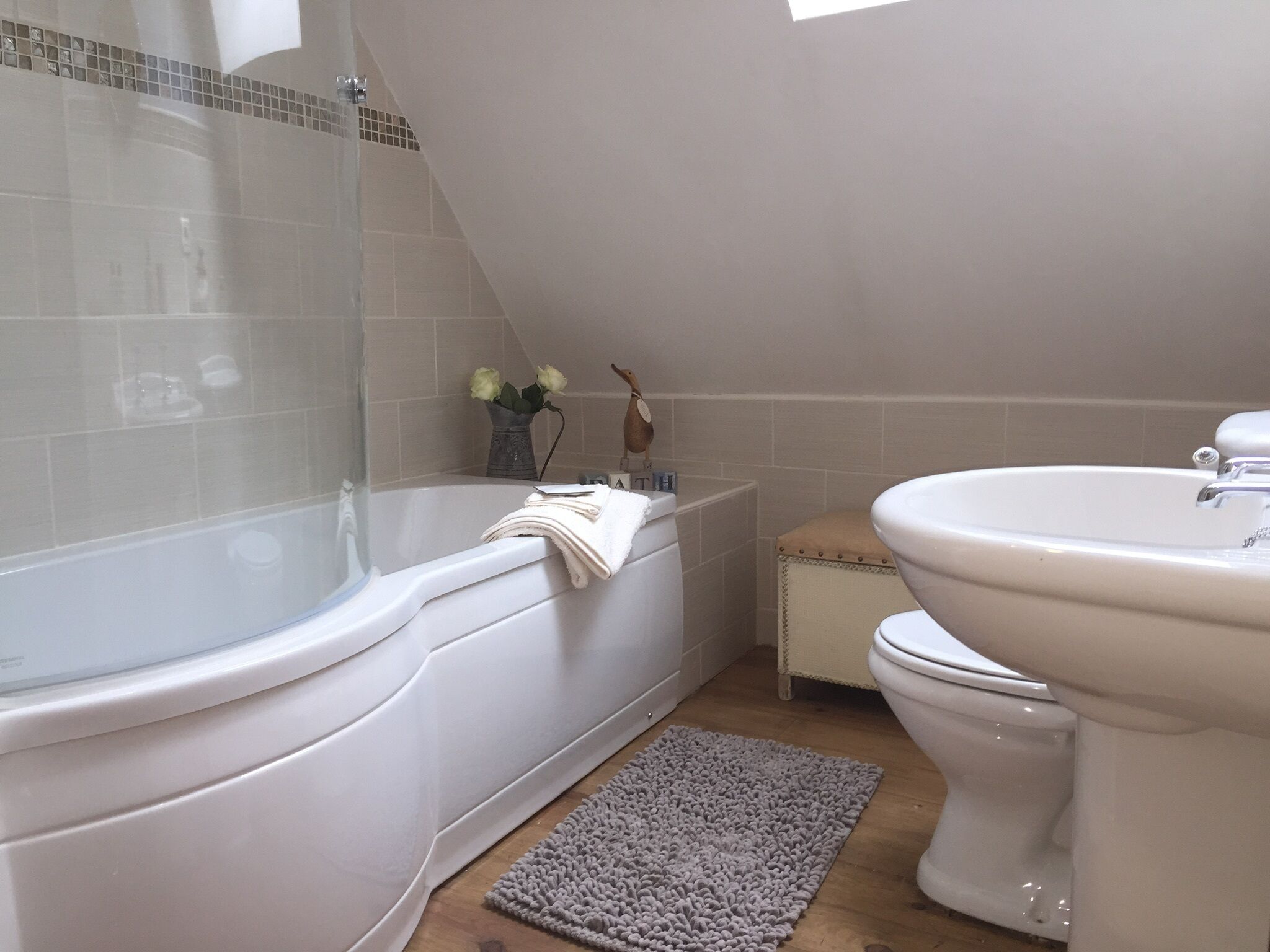 Combined shower/tub, hair dryer, towels, soap