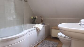 Combined shower/tub, hair dryer, towels, soap