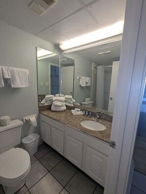 Combined shower/tub, hair dryer, towels, soap