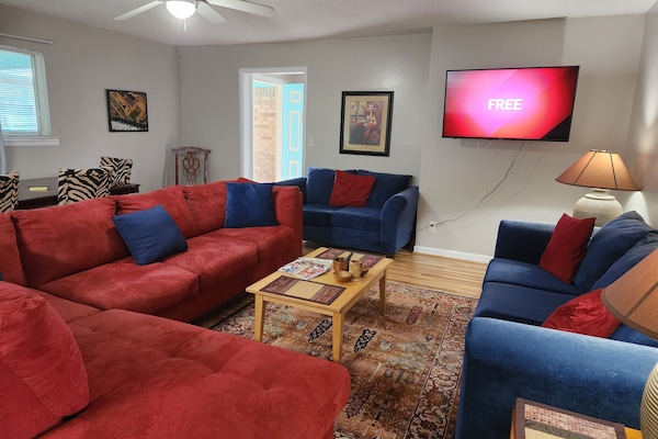 spacious living room with smart tv
