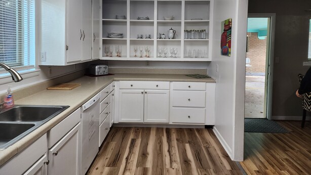 A kitchen with white cabinets, a countertop, a sink, and a toaster. - Close to Downtown, Restaurants, Markets , Events ,Beaches and Naval Base! (Pensacola)