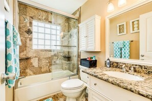 Combined shower/tub, hair dryer, towels, soap