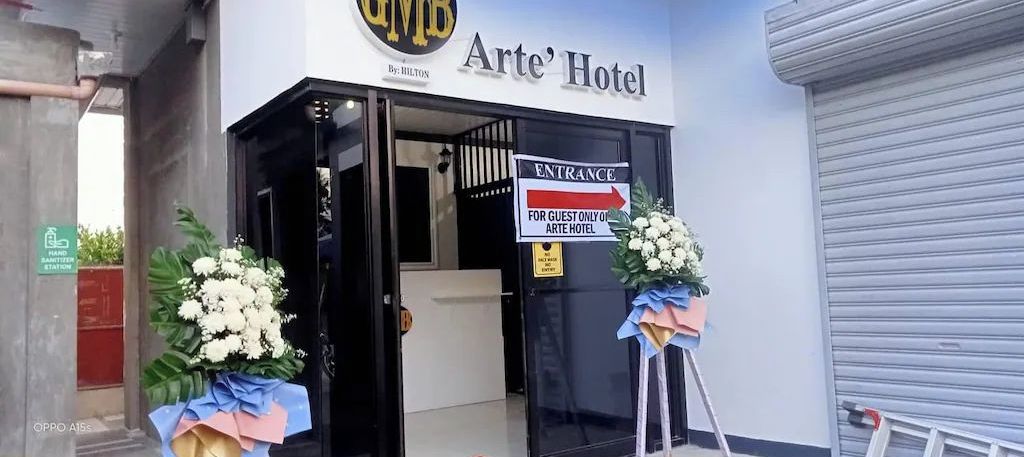 The entrance to Arte' Hotel with a sign indicating guest-only access.