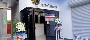 The entrance to the Arte' Hotel with a sign indicating it's for guests only.