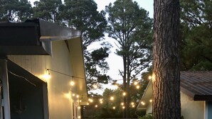 A wooden deck with a barbecue grill, string lights, and a covered seating area. - fishing ~ plenty of parking ~ 1/2 mile to marina ~ 5 min to new WestBay casino (Mead)