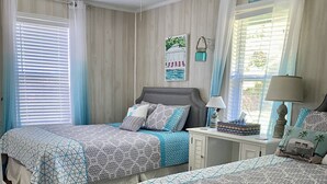 A bedroom with two beds, a ceiling fan, a window with blinds, a nightstand, and a lamp. - fishing ~ plenty of parking ~ 1/2 mile to marina ~ 5 min to new WestBay casino (Mead)