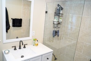 Shower, hair dryer, towels, toilet paper