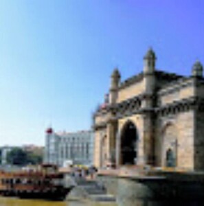 Stunning historic landmark with a grand archway, situated near a body of water.