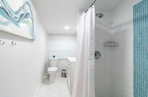 Shower, hair dryer, towels, soap