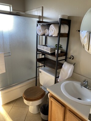Combined shower/bathtub, hair dryer, towels, soap