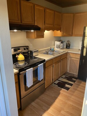 Fridge, microwave, stovetop, coffee/tea maker