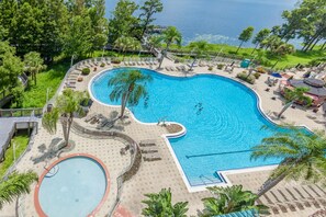 2 outdoor pools, open 10:00 AM to 10:00 PM, pool loungers - Lakefront Resort in Heart of Orlando Attractions - Tu Casa Vacations (Orlando)