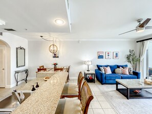 Family apartment unit 1-1109 (13415 Blue Heron Beach Drive,Orlando) | Living area | 60-inch flat-screen TV with cable channels, TV - Lakefront Resort in Heart of Orlando Attractions - Tu Casa Vacations (Orlando)
