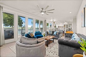 Family room with waterfront view and Mt. Rainier