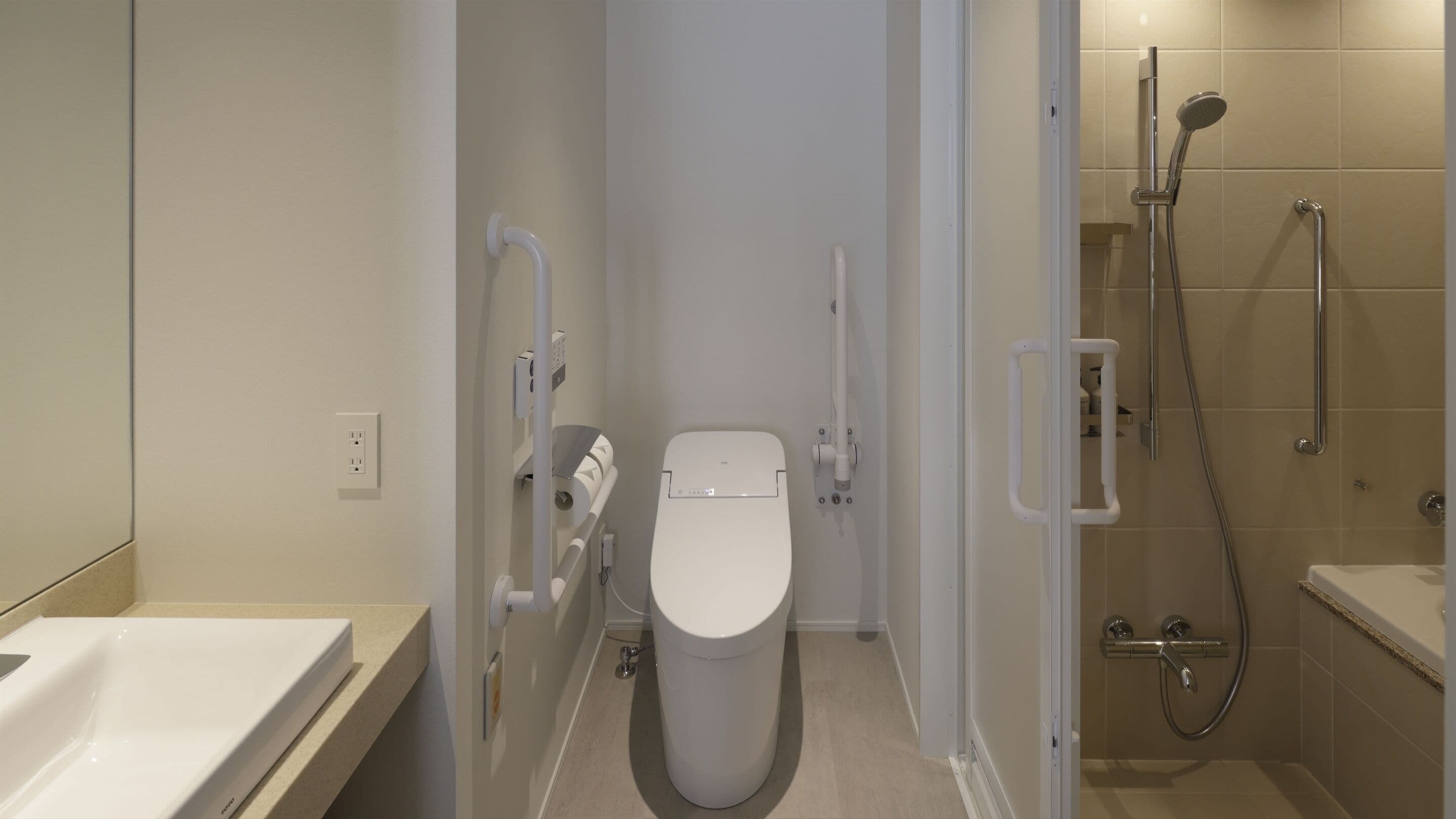 A modern bathroom with a toilet, a shower, and a bathtub.