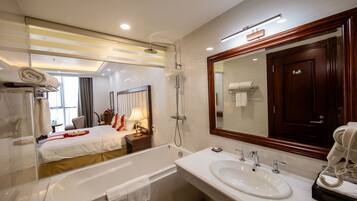 Superior Double Room | Bathroom | Combined shower/tub, rainfall showerhead, designer toiletries
