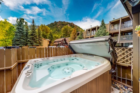 Outdoor spa tub. Main St. gem - pool & hot tub - walk to lifts, dog-friendly, ground-floor