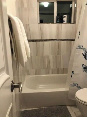 Combined shower/tub