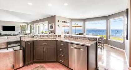 Two-story, bay front retreat with a deck, direct beach access, and washer/dryer