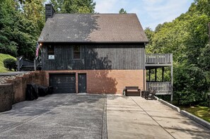 A two-story building with a brick facade and a dark roof.