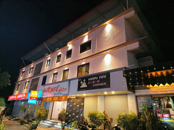 A hotel with a signboard for 'Mari Aai Kebab Corner' and an ATM sign. - hotel mari aai residency (Panvel)