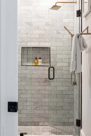 Shower, hair dryer, towels, shampoo