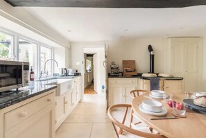 Fridge, microwave, oven, stovetop - Architect Designed Cosy Cotswold Stone Cottage (Gloucestershire)