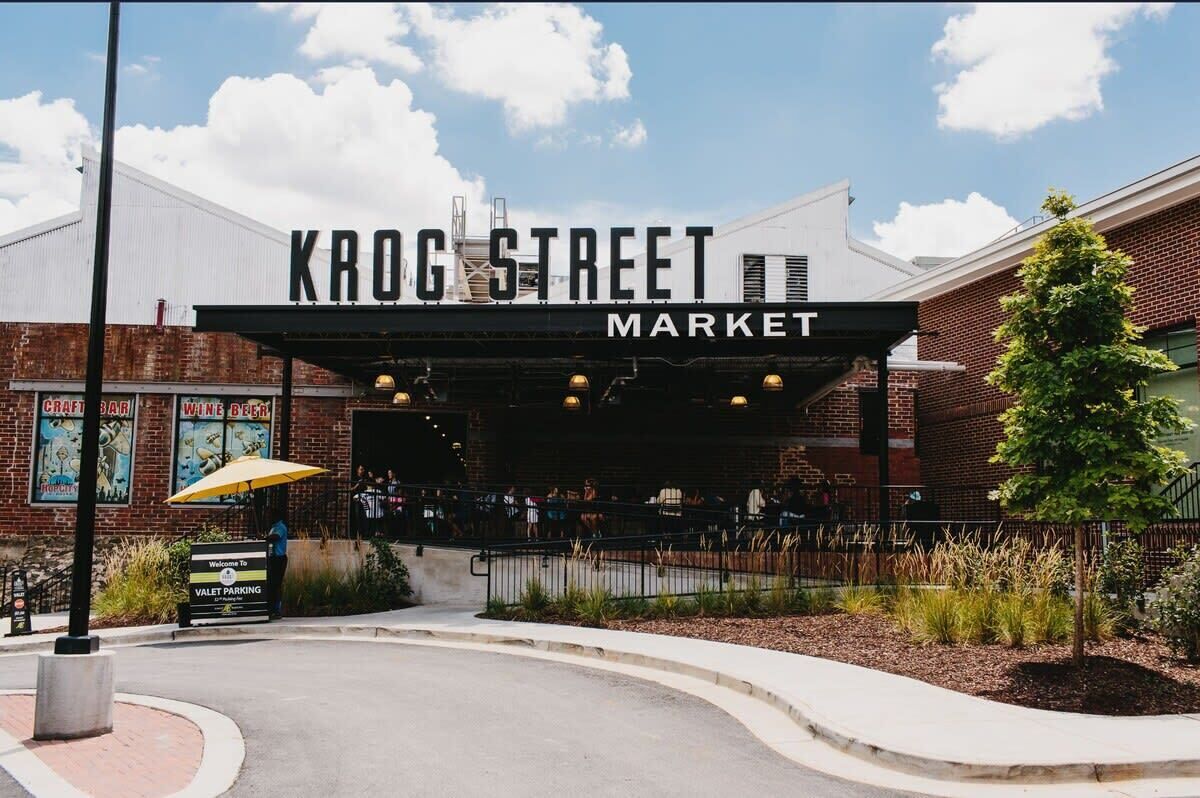 Krog Street Market with a covered entrance, a sign for a craft bar, and a wine bar.