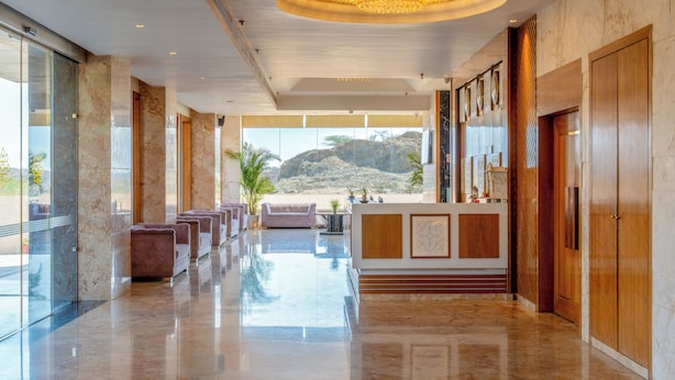A spacious lobby with a marble floor, a reception desk, and seating area. - Paandora Grand Udaipur (Udaipur)
