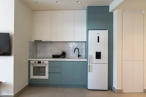 Superior Apartment | Private kitchen | Full-size fridge, oven, stovetop, espresso maker