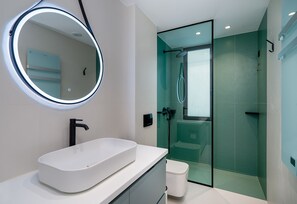 Shower, rainfall showerhead, hair dryer, towels