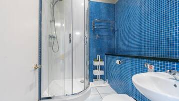 Shower, hair dryer, towels, shampoo