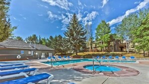 A pool area with lounge chairs and a small circular pool. - Walk to Ski | Hot Tub | Great Location (Park City)