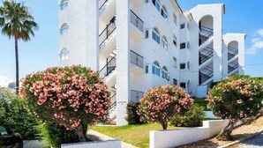 A multi-story building with balconies and a white exterior. - Lovely Apt with Pool by Costarentals - Ref 07 (Málaga)
