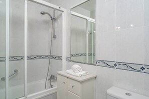 Bathtub, hair dryer, towels