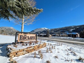 Welcome to The Enclave, situated in a serene mountain setting.
