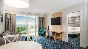 Desk, iron/ironing board, bed sheets