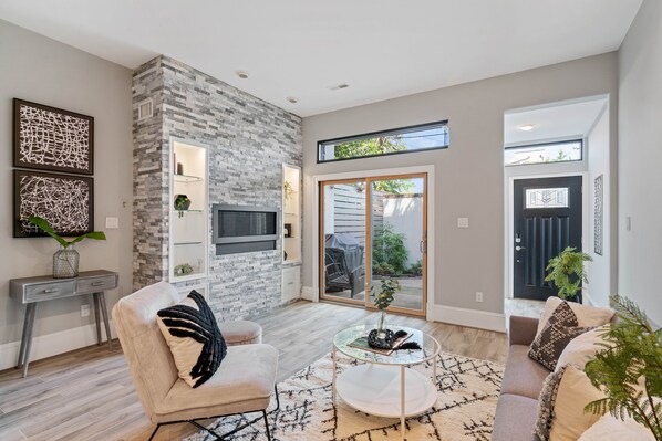 Smart TV, fireplace, books, printers