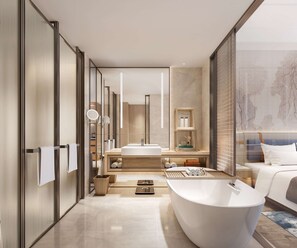 A modern bathroom with a freestanding bathtub, a large mirror, and a vanity with a sink. - DoubleTree by Hilton Guangzhou Zengcheng (Guangzhou)