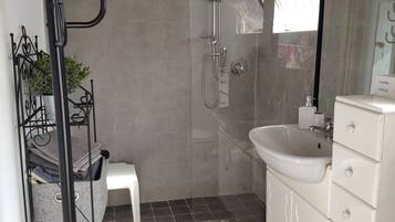 Shower, hair dryer, towels, soap