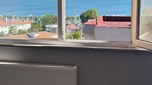 A room with a view of the sea, a radiator, and a window sill. - Verseca Hotel (Istanbul)
