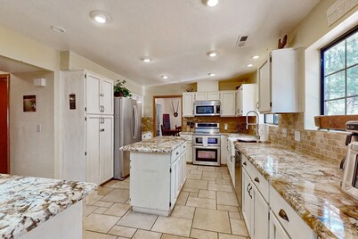 Lavish retreat with game room, tranquil porch & scenic yard-near skiing & dining